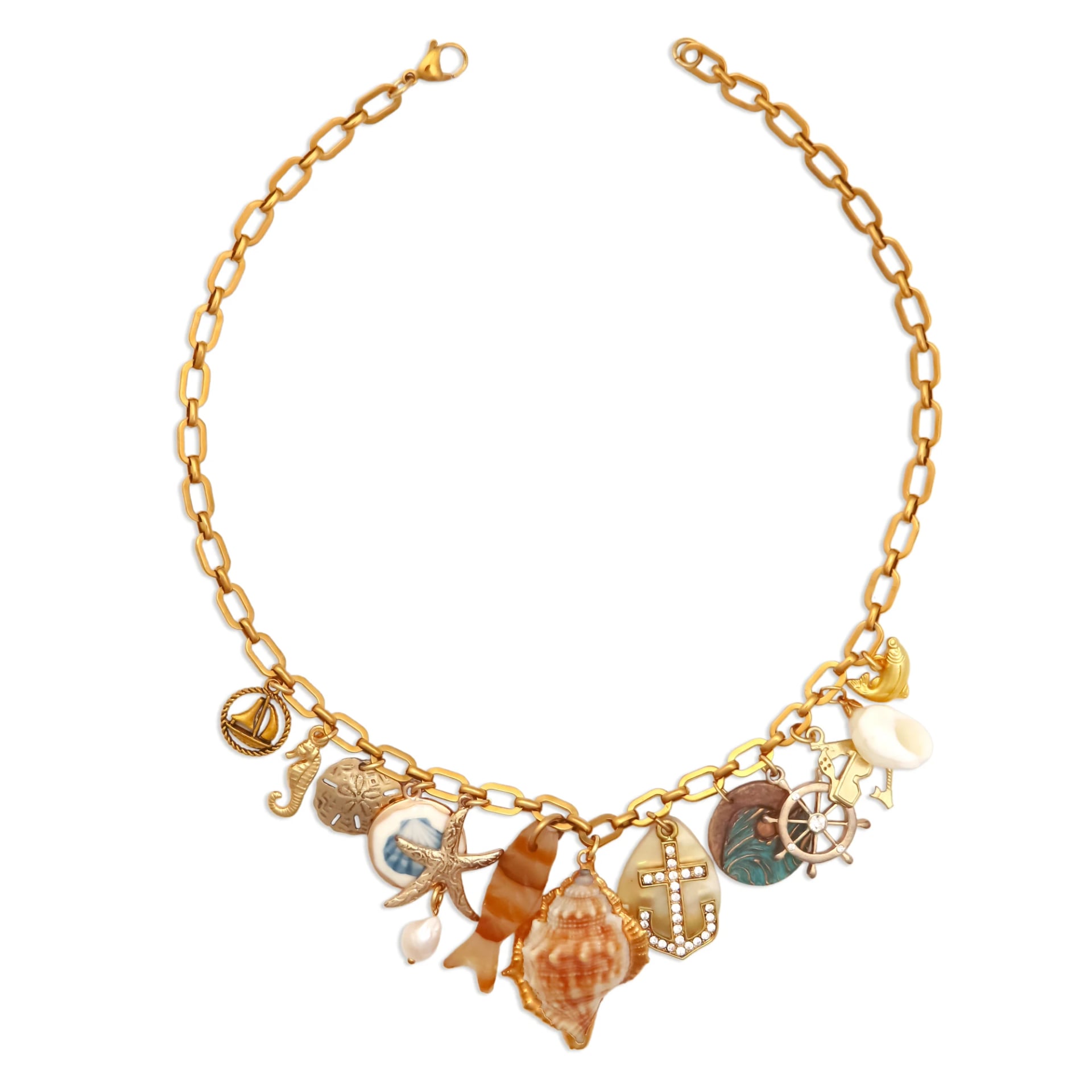 18k gold plated nautical charm necklace with seashell, anchor, and starfish charms on a model, by Enleira
